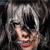 Pixelated close-up of a person with light skin, pink lips, and dark eyes, wearing a white headband and dark clothing against a dark background.
