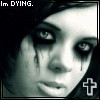 A grayscale close-up of a person's face with dark eye makeup and tears streaming down, a white cross symbol in the corner, and text reading 'Im DYING.'