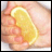 A hand holds a lemon slice with text overlays reading 'Let me squeeze your Lemon' in pixelated yellow font.