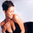 Static pixelated image of a shirtless person with dark hair in profile view, wearing black bottoms against light background.
