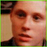 pixelated images showing a person in light blue shirt and dark tie, with varying facial expressions and partial face visibility across frames