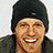 Pixelated image of a smiling person wearing a black beanie and dark jacket, with blue text reading 'Gregg Russell' on the right and 'Best Top Dancer Ever' below.