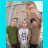 A small image of three people standing together on a light blue background with partial text fragments scattered around.