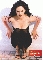 Static pixelated image of a woman in a black dress with arms raised, standing on a beach-like background with red text at the bottom.