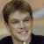 Static image of a person with short brown hair and dark clothing against a light background, next to green text reading 'Original Icons .com' on a solid green field.