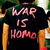 Pixelated image of a person wearing dark clothing with pink text reading 'WAR IS HOMO' against a blurred background.