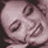 Pixelated grayscale image of a person's face with closed eyes and mouth, rendered in low resolution at 48x48 pixels.