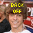 A person with brown hair wearing a white shirt and dark jacket, standing in front of red and blue striped background with yellow text overlays.
