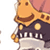 Pixelated cartoon character with orange giraffe-like head, dark blue body, and white piano keys on chest, holding golden object against pink background.