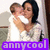 A pixelated image shows two people embracing, one with dark hair holding a child with light brown hair, both wearing white tops, with a purple banner reading 'annyc00l' at the bottom.