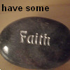 A dark oval-shaped object with the word 'Faith' in silver lettering, set against a light brown background with the text 'have some' above it.