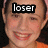 Pixelated close-up of a person's face with the word 'loser' overlaid in white text on black background, showing visible pixelation and orange clothing at bottom right.
