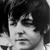 Black-and-white pixelated image of a person with dark hair, closed eyes, and a neutral expression, cropped to show only the upper face and shoulders.
