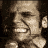 Pixelated image of a person with text reading "F*CK THIS GAME! It's 4:00 in the morning Grandma! YOU WIN!" in beige and red pixel fonts on dark background.