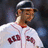 A pixelated image of a baseball player in a white uniform with red lettering, set against a solid red background with multiple lines of text.