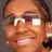 A 48x48 pixel animated contact sheet showing two frames of a person's face with glasses and earrings, each frame featuring a different colored heart icon at the bottom right corner.