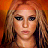 A 48x48 pixel buddy icon featuring a stylized portrait of a person with long light brown hair against an orange background, paired with text elements in a contact sheet layout.