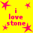 Yellow background with pink starbursts and repeated text "i love stone" in pixelated font, arranged in a pattern