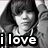 Black-and-white image of a person in a hooded jacket with text overlays reading 'i love justin' and 'bieber' in pixelated font.