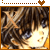 Pixelated image of a character with brown hair and dark eyes, wearing an orange garment under bright lighting.