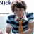 Pixelated image of a person with dark curly hair wearing a blue and black striped shirt and an orange tie, with partial text 'Nick' visible in the top-left corner.