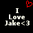 Red pixelated heart above white text reading "I Love Jake<3" on black background, with two identical side-by-side versions of the text.