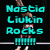 A gymnast in a red and white leotard performs on parallel bars with cyan text reading "Nastia Liukin Rocks !!!!" against a black background.