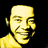 Pixelated yellow-toned portrait of a smiling person with short hair next to bold text reading BILL WITHERS on black background