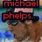 Pixelated image of a brown dog wearing sunglasses and an American flag hat with red text reading "michael phelps... is freakin beast=)".