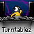 Pixel art animation of a yellow-clad figure with white face and black hair operating turntables, set against blue background with purple and green lines.