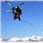 A helicopter flies over snowy mountains with text fragments 'This', 'is', and 'the life' displayed on a black background.