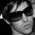 Black-and-white image with a person wearing sunglasses on the left, and stylized text reading 'Prince of Punk' in white gothic font on black background.
