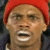 A static pixelated image shows a person wearing a red head covering, with visible facial features including eyes, nose, mouth, and skin tone.