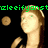 Pixelated image of a person with light brown hair and green eyes, wearing a dark top, with green text above and a brown circular shape on the left.