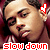 A 50x50 pixel animated contact sheet showing two side-by-side frames of a person with dark hair wearing a striped shirt, red heart icons near ears, and "slow down" text at the bottom in red block letters.