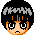Pixel art of a character with black hair and gray highlights, showing two expressions: neutral on the left, smiling with pink cheeks on the right.