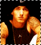 Animated sequence showing a person with tattoos on shoulders wearing dark sleeveless shirt and cap, transitioning through text variations of 'What A CUTIE' against black background with decorative swirls.