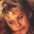 Pixelated close-up of a person's face with brown hair and warm lighting, displayed as a static 50x50 icon.
