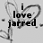 Pixelated black text reads "i love jarred." on a light gray background with faint, blurry heart-shaped outlines.