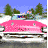 Animated contact sheet showing six frames of a pink vintage car driving through snowy landscape with pine trees under blue sky.