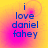 Blue text reading "i love daniel fahey" on a yellow-to-pink gradient background with subtle circular patterns.