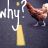 Pixelated icon shows stylized white text 'why' on dark background with yellow vertical bar and brown figure silhouette.