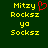 Yellow pixelated text on dark green background with red heart symbol above 'Rocksiz' in left ; right shows same text without heart