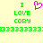 Pixelated green text and a pink heart symbol on a pale yellow background, with repeated 'I LOVE CORY' text below.