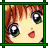 Pixelated close-up of a character's face with large eyes, red hair, and a small red mouth, framed by a green border.