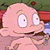 Pixelated cartoon character with large eyes and pink skin holding a dark object, set against green foliage and red background elements.
