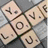 A four- with pixelated text and a Scrabble-like arrangement on the top-left