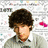 A pixelated image of a person with dark curly hair wearing a light gray shirt, accompanied by pink text reading "I love Nick Jonas!" and floating pink hearts.