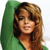 A pixelated portrait of a person with long brown hair wearing a green garment against a white background.