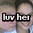 Two people in a close-up pose with one person's head near the other's shoulder, text overlay reading 'luv her' on top-left frame.